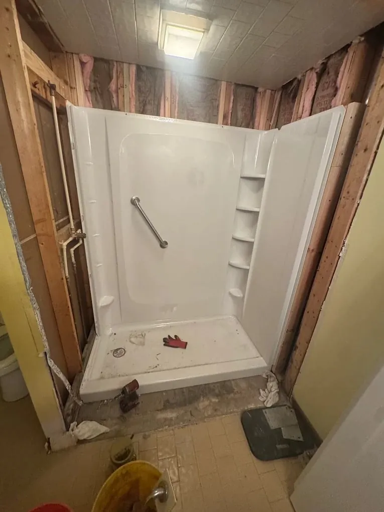 Fleming Island plumber installing a walk-in shower — R Stud Plumbing