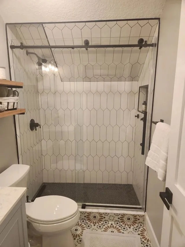 Finished bathroom remodel with walk-in shower and vanity