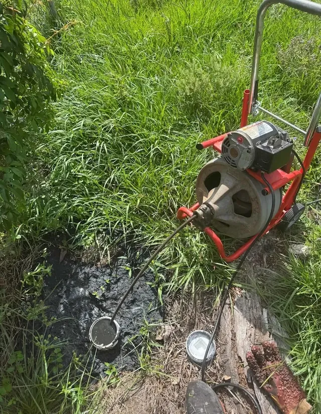 Residential sewer cleaning cable work in progress