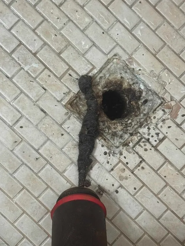 Sewer drain inspection finding hair clog in shower drain
