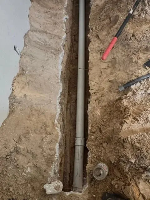 New PVC water line laid in a deep excavated trench